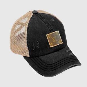 Distressed baseball cap with designer leather patch